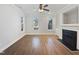 This is a living room with hardwood floors, fireplace, built-ins and windows at 25 Scotch Bonnet Rdg, Clayton, NC 27520