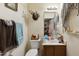 This bathroom features essential fixtures and a simple vanity with a mirror above at 2513 Drexall Ave, Durham, NC 27704