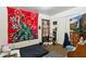 This bedroom features a bed, TV, closet, and unique peacock-themed decor at 2513 Drexall Ave, Durham, NC 27704