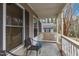 Cozy front porch with seating and a view of the peaceful surroundings at 2513 Drexall Ave, Durham, NC 27704