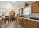Spacious kitchen leading to dining area with wood cabinetry and natural light at 2513 Drexall Ave, Durham, NC 27704