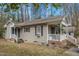 Inviting home exterior featuring a porch, siding, and well-maintained yard space at 2513 Drexall Ave, Durham, NC 27704