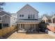 Exterior shot of the back of house with a patio and a spacious backyard at 304 Shepherd St, Raleigh, NC 27607