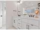 Elegant bathroom featuring double sinks, a large mirror, and sleek fixtures at 304 Shepherd St, Raleigh, NC 27607