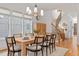Elegant dining room with wooden table, seating for six, chandelier, and natural light at 304 Shepherd St, Raleigh, NC 27607