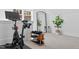 Home gym with exercise equipment, a large mirror, and ample space, promoting a healthy lifestyle at 304 Shepherd St, Raleigh, NC 27607
