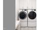 Convenient laundry area featuring modern washer and dryer units with stylish floors and storage cabinets at 304 Shepherd St, Raleigh, NC 27607