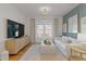 Cozy living room with a modern television, elegant lighting fixture, and a comfortable seating arrangement at 304 Shepherd St, Raleigh, NC 27607