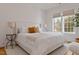 Inviting main bedroom with a large bed, cozy decor, and abundant natural light from the windows at 304 Shepherd St, Raleigh, NC 27607