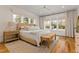 Bright and airy main bedroom with lots of natural light, and a decorative bench at the foot of the bed at 304 Shepherd St, Raleigh, NC 27607