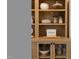 Close up of shelving in the dining area with decorative items and bread storage at 304 Shepherd St, Raleigh, NC 27607