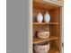 Built-in shelving with decorative vases and wooden bowls in the home at 304 Shepherd St, Raleigh, NC 27607