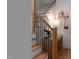 Wooden staircase with black iron spindles, along with table, desk, and décor accents at 304 Shepherd St, Raleigh, NC 27607