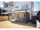 Enclosed back porch with fan and comfortable seating area overlooking a large backyard at 304 Shepherd St, Raleigh, NC 27607