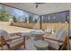 Cozy outdoor sunroom with comfortable seating and a view of the spacious backyard at 304 Shepherd St, Raleigh, NC 27607