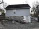 Exterior view with neutral siding and a gravel yard highlighting the property's access to the rear at 312 East End Ave, Durham, NC 27703