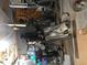 Packed basement interior featuring stored equipment, boxes, and various household items at 312 East End Ave, Durham, NC 27703
