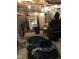Cluttered basement with exposed ceiling and concrete block walls displaying various stored items at 312 East End Ave, Durham, NC 27703
