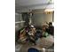 Basement interior featuring a water heater, tools, and assorted stored belongings on a bare floor at 312 East End Ave, Durham, NC 27703