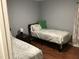 Bedroom featuring two twin beds and a dark wood side table at 312 East End Ave, Durham, NC 27703