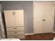 Bedroom with a white storage cabinet next to double door closet at 312 East End Ave, Durham, NC 27703