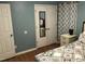 Bedroom featuring a mirrored closet door and stylish light-blue walls at 312 East End Ave, Durham, NC 27703