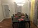 Elegant dining room with a modern chandelier and seating for six at 312 East End Ave, Durham, NC 27703