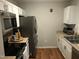 Well-equipped kitchen with stainless steel refrigerator and ample countertop space at 312 East End Ave, Durham, NC 27703