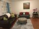 Comfortable living room featuring hardwood floors, neutral colors, and abundant natural light at 312 East End Ave, Durham, NC 27703