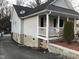 Well-maintained home with neat siding, a front porch, and a tidy yard featuring a small tree at 312 East End Ave, Durham, NC 27703