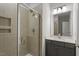 Bathroom featuring granite countertops, gray vanity and glass enclosed shower at 319 N Maple Walk # 213, Garner, NC 27529