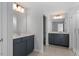 This bathroom has a double sink vanity, tile floors, and glass enclosed shower at 319 N Maple Walk # 213, Garner, NC 27529