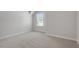 Bright bedroom with neutral carpet, fresh paint and natural light at 319 N Maple Walk # 213, Garner, NC 27529