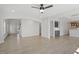 Expansive living room with hardwood floors, arched doorways, and a view of the kitchen and dining area at 319 N Maple Walk # 213, Garner, NC 27529