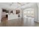 Spacious open-concept living room flowing into a modern kitchen with ample counter space and natural light at 319 N Maple Walk # 213, Garner, NC 27529
