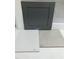 Image showcasing kitchen remodel material samples with gray cabinet and stone-look countertops at 319 N Maple Walk # 213, Garner, NC 27529