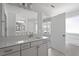 Light and airy bathroom featuring a tub, and a white vanity with bright lighting at 322 N Maple Walk Walk # 237, Garner, NC 27529