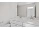 Bathroom with double sinks, granite countertops, and modern fixtures at 322 N Maple Walk Walk # 237, Garner, NC 27529