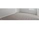Bright bedroom featuring neutral walls, plush carpeting, and ample natural light at 322 N Maple Walk Walk # 237, Garner, NC 27529