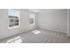 Bright bedroom featuring two bright windows, and plush carpeting at 322 N Maple Walk Walk # 237, Garner, NC 27529