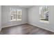 Sun-filled bedroom with natural light, wood-look flooring, and a view of the outdoors at 322 N Maple Walk Walk # 237, Garner, NC 27529