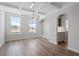 Elegant dining room with coffered ceilings, hardwood floors, and modern light fixture at 322 N Maple Walk Walk # 237, Garner, NC 27529