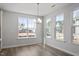 Well-lit dining area with large windows offering a view of the surrounding neighborhood at 322 N Maple Walk Walk # 237, Garner, NC 27529