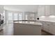 Bright, open kitchen featuring a large island, stainless appliances and white cabinets at 322 N Maple Walk Walk # 237, Garner, NC 27529