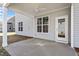 Covered patio boasts white columns and ample space for seating and entertaining at 322 N Maple Walk Walk # 237, Garner, NC 27529