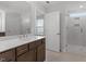 Bright bathroom featuring dual vanity, quartz countertop and separate tiled shower at 347 N. Maple Walk Dr # 211, Garner, NC 27529