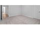 Spacious bedroom with plush carpeting and neutral paint at 347 N. Maple Walk Dr # 211, Garner, NC 27529