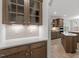 Gourmet kitchen with ample counter space, custom cabinets, tile backsplash, and stainless steel appliances at 347 N. Maple Walk Dr # 211, Garner, NC 27529