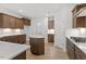 Beautiful kitchen featuring an island, gas stovetop, and stainless steel appliances at 347 N. Maple Walk Dr # 211, Garner, NC 27529