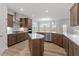 Open-concept kitchen with a large island, stainless steel appliances, and stylish cabinetry at 347 N. Maple Walk Dr # 211, Garner, NC 27529